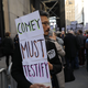 Protesters gather outside of Trump Tower a day after FBI Director James Comey was fired by President Donald Trump on May 10, 2017 Photo by Spencer Platt/Getty Images)